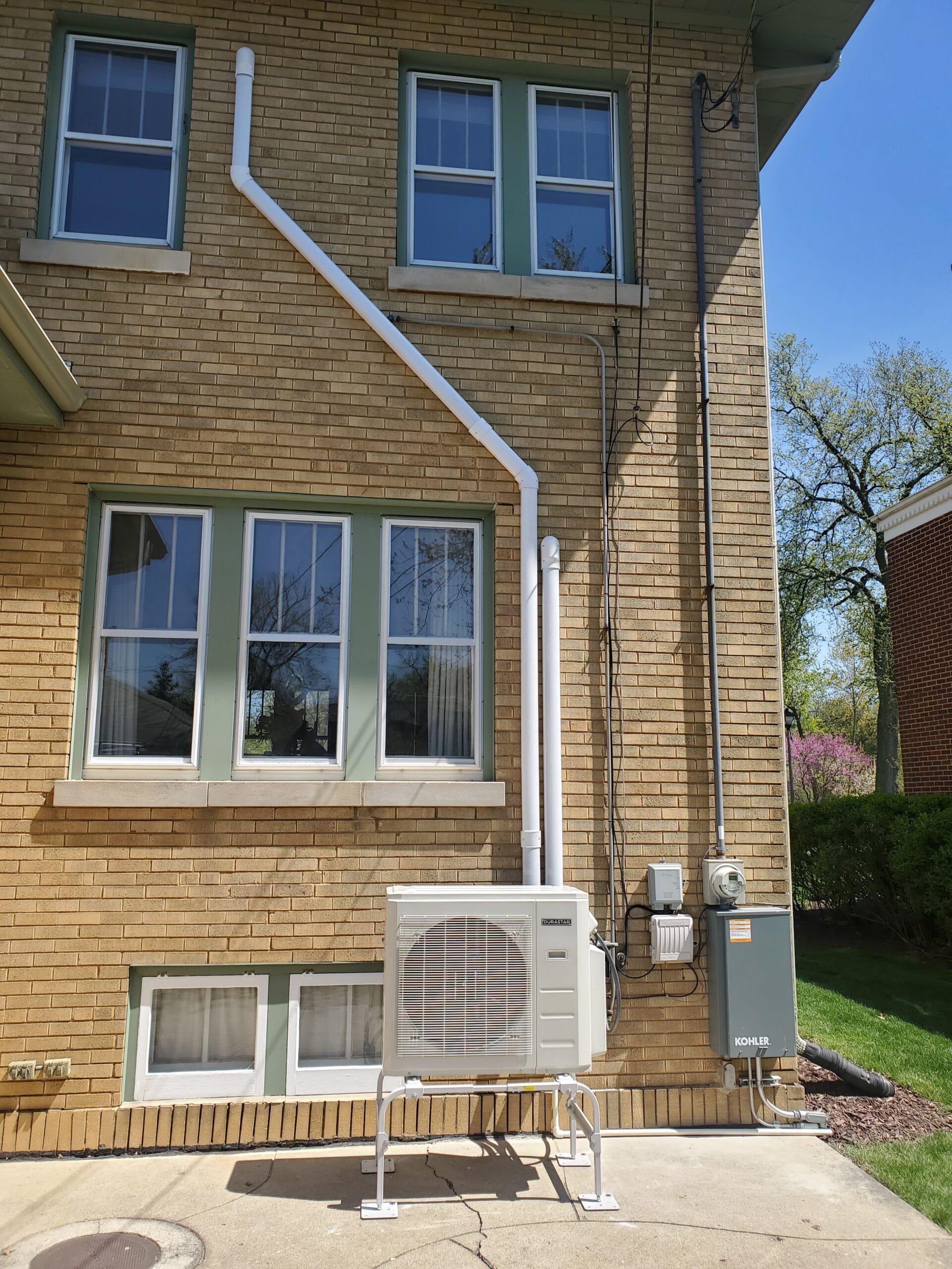 A mini-split heat pump with the line-sets, drains and wires concealed in line-hide.