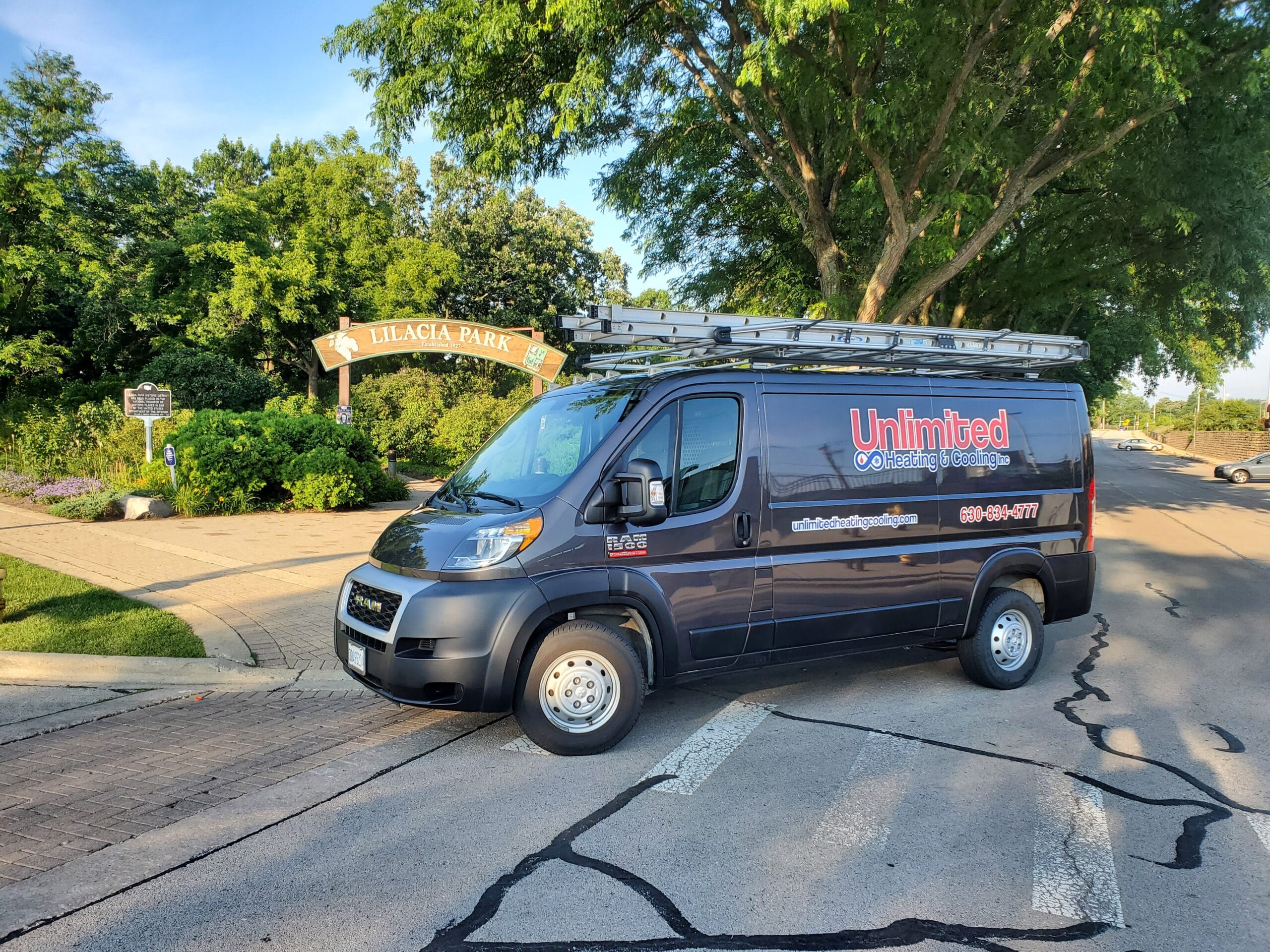 Unlimited Heating & Cooling Inc. service truck in front of Lilacia Park in Lombard, IL.